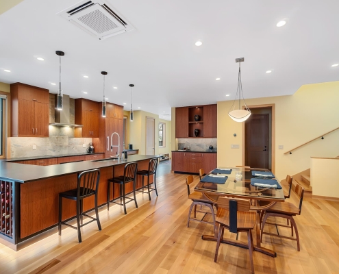 redesigned and remodeled open kitchen and dining area with cabinet under-mount ambient lighting effects