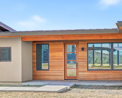 modern design home exterior entry with cedar and stucco